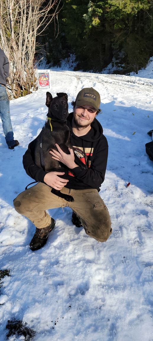 A person with a dog | Eastside Speedshop LLC