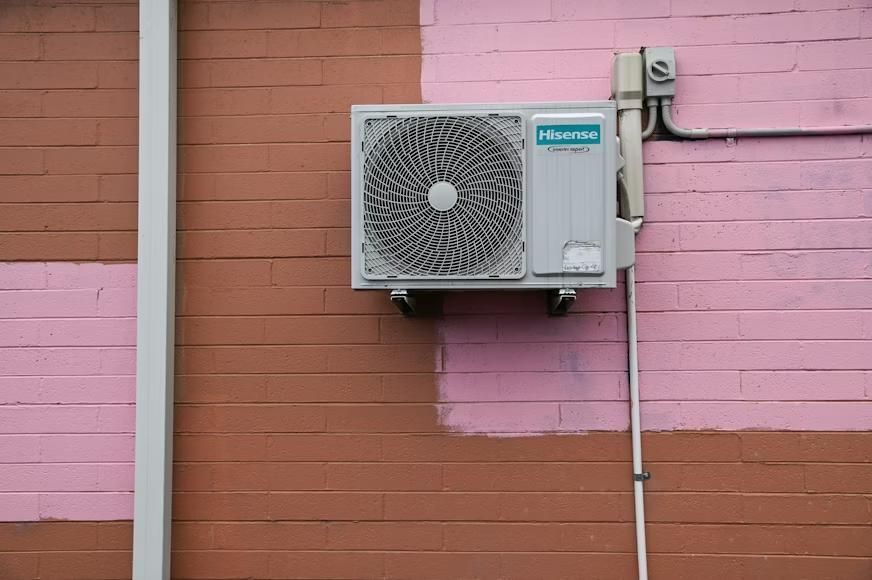HVAC system mounted on a brick wall