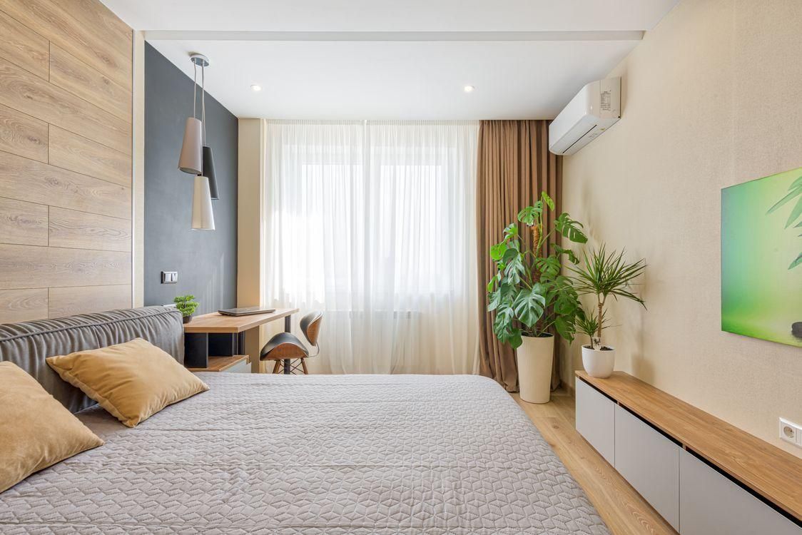 a bedroom with an air conditioner