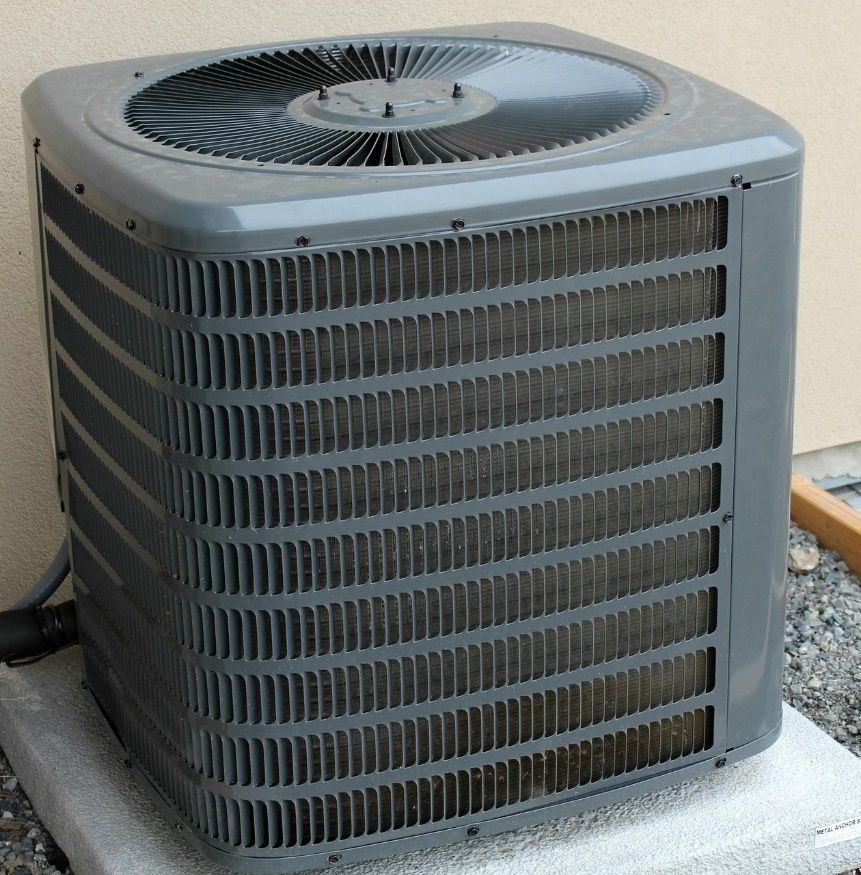 A grey, modern HVAC outdoor component.