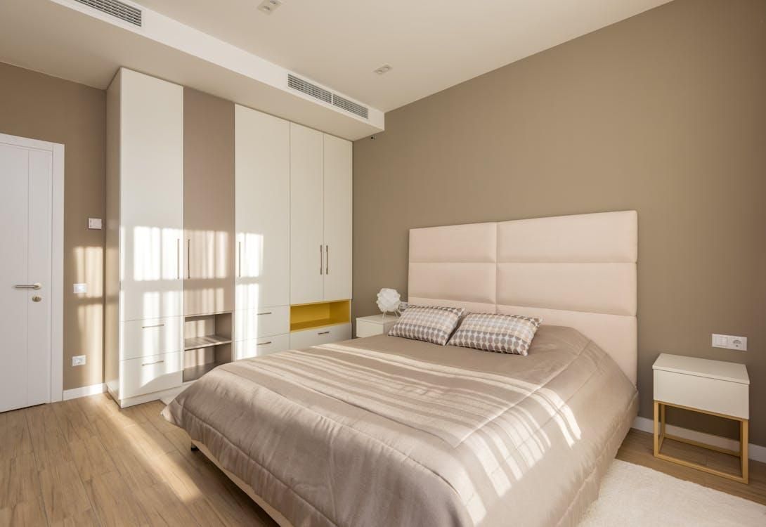An image of a bedroom with an AC   