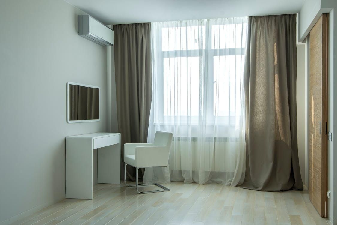 An image of a room with a vanity table and an AC 