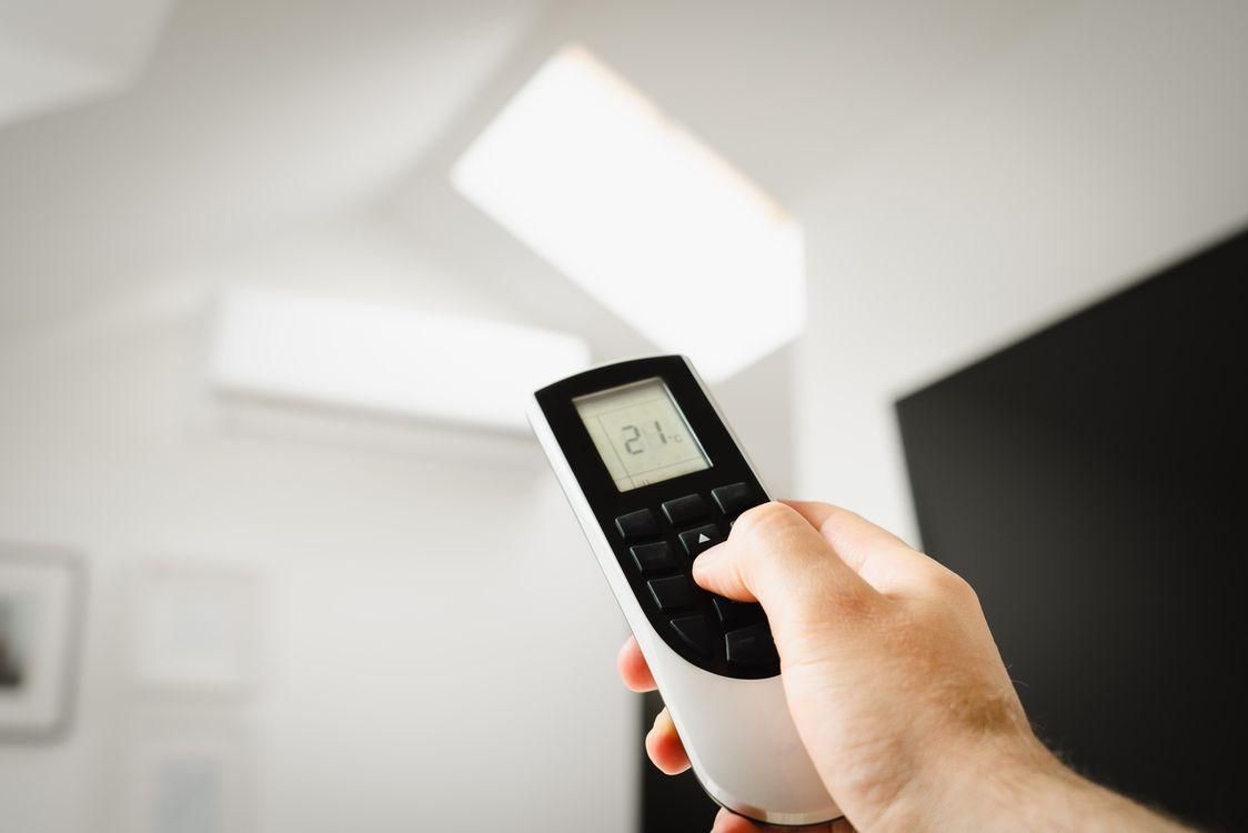 a man holding a remote.