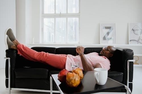 A man looks relaxed indoors while enjoying his AC.