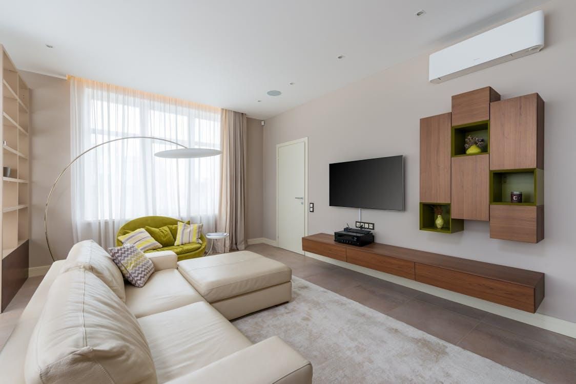 modern living room with a wall-mounted air conditioning unit for home comfort