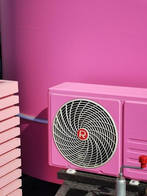 A pink HVAC on a pink wall