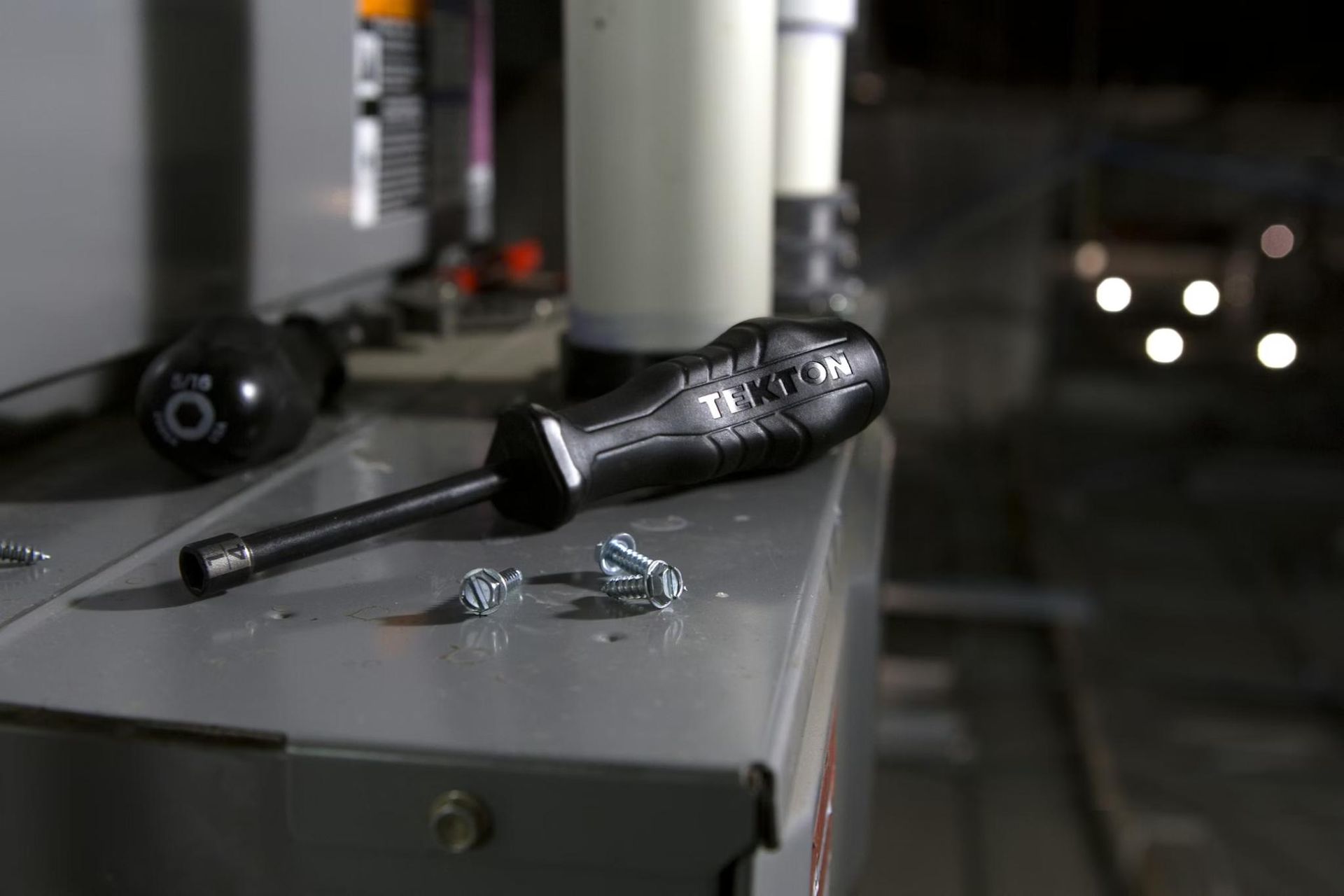 A screwdriver on a table during HVAC maintenance.
