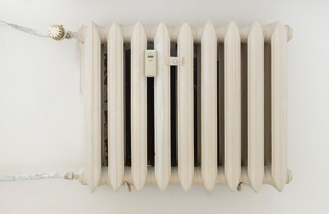  Traditional wall-mounted radiator heater used for home heating during winter, highlighting older he