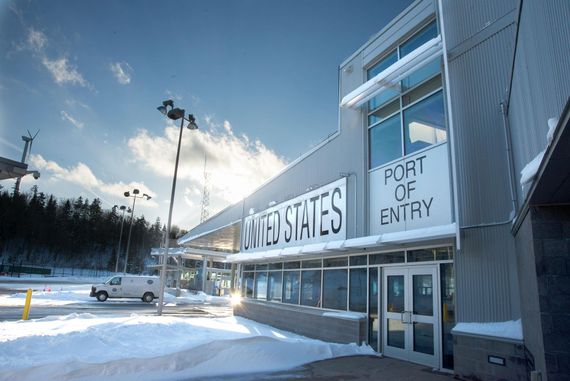 A building with a sign that says port of entry on it