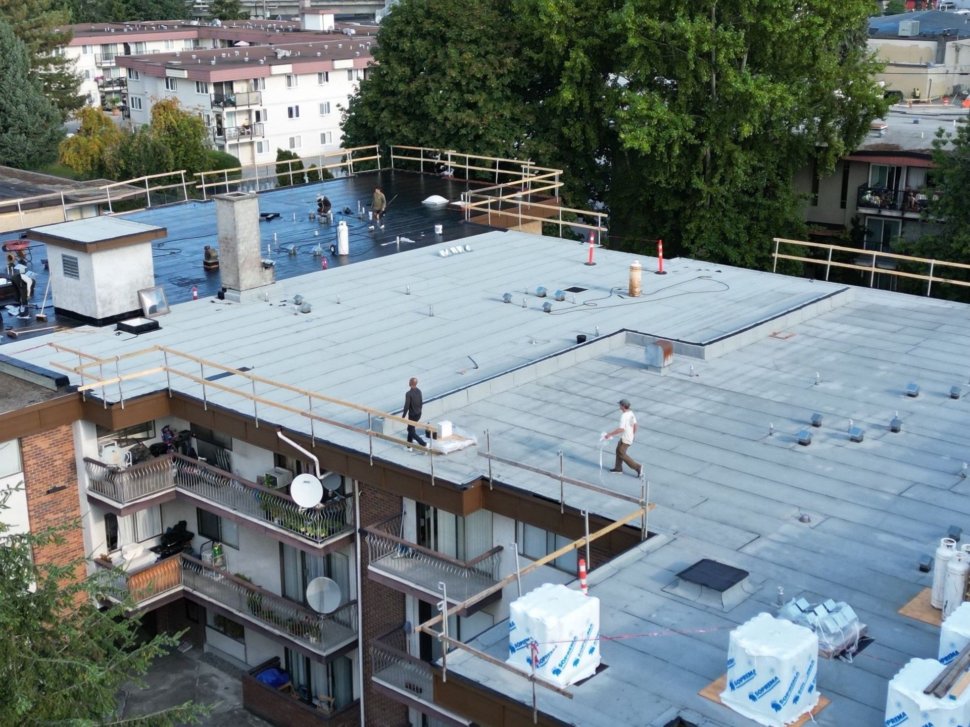 expert workers repairing roof