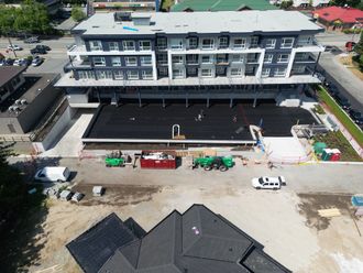 construction worker coating epoxy paint roof slab