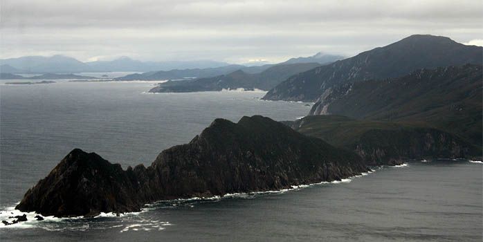 A large body of water with mountains in the background