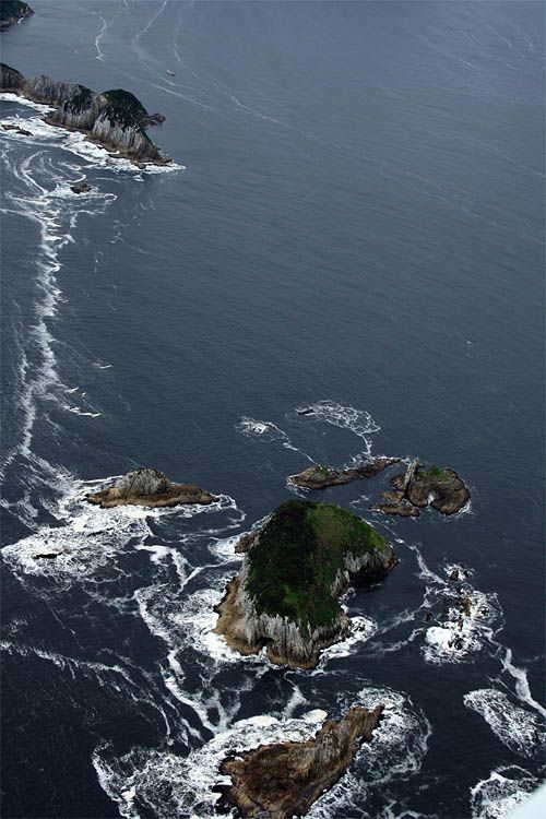 An aerial view of a small island in the middle of the ocean