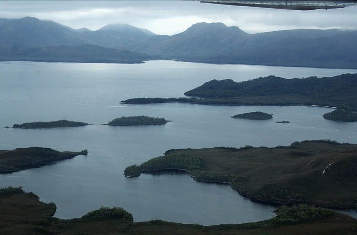A large body of water with mountains in the background