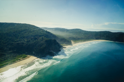 Aerial view of coastal cliffs and shoreline.