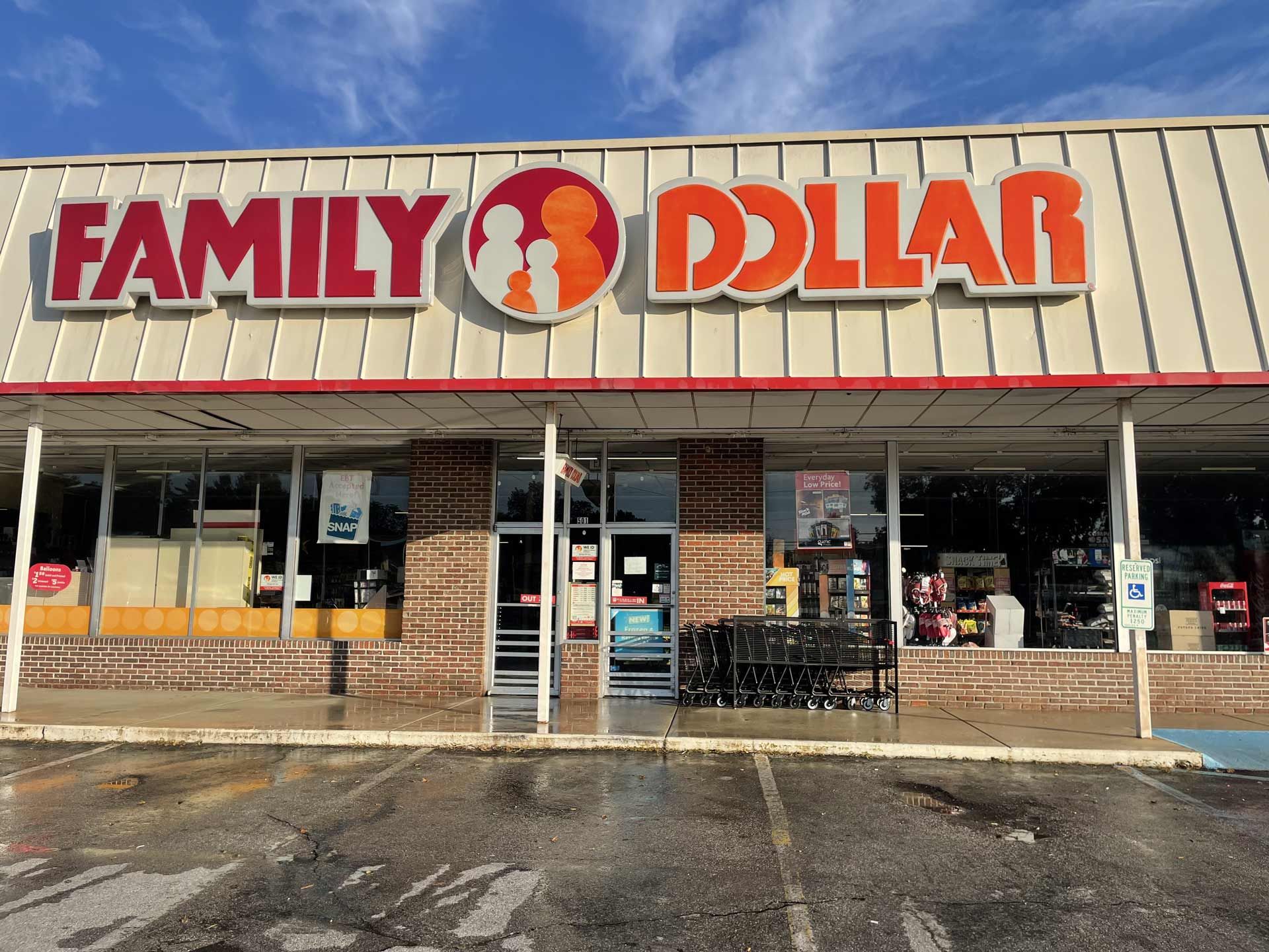 A family dollar store with a shopping cart in front