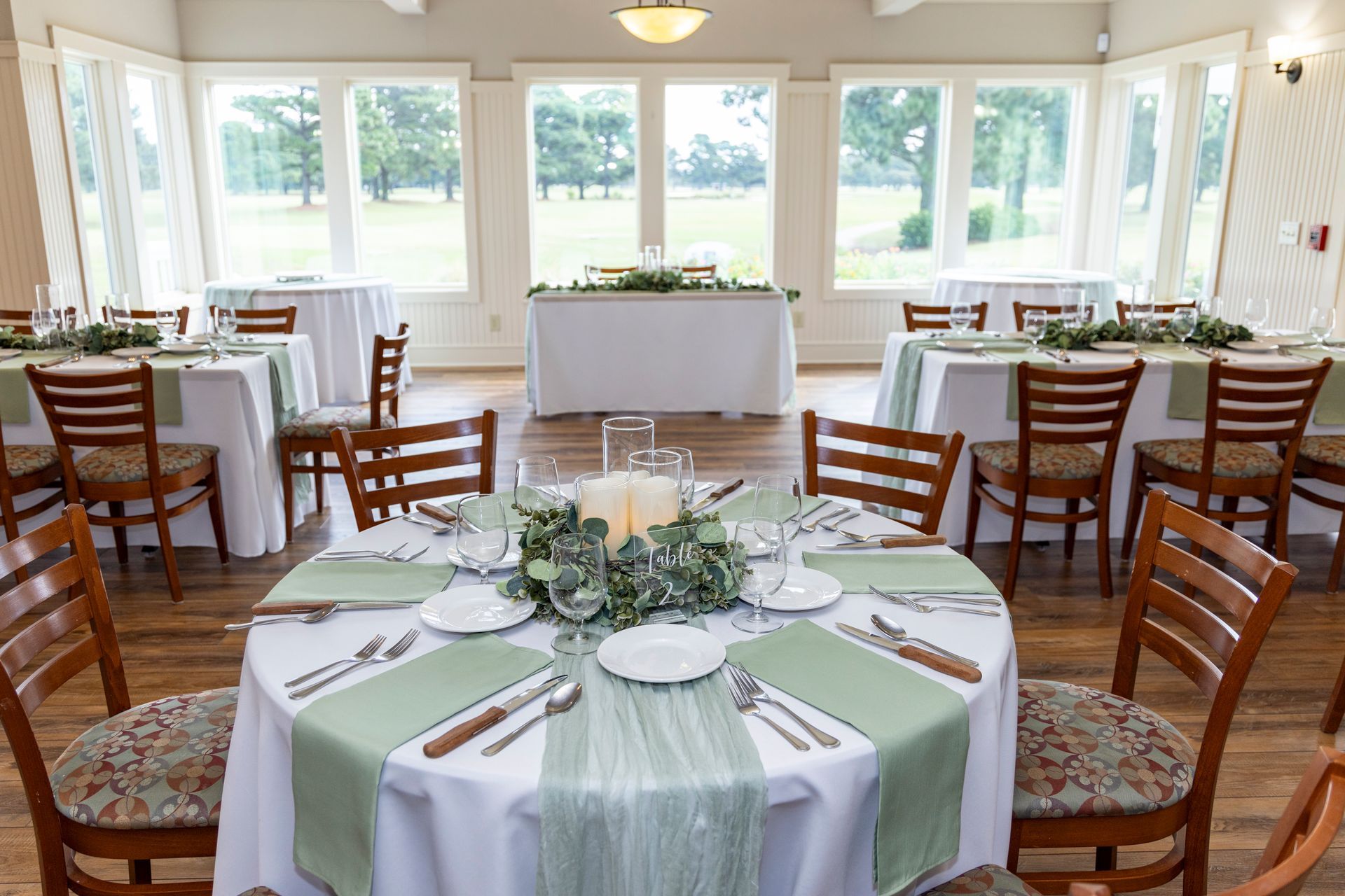 Wedding reception in the Event Room with golf course views set up at The Pointe Golf Club
