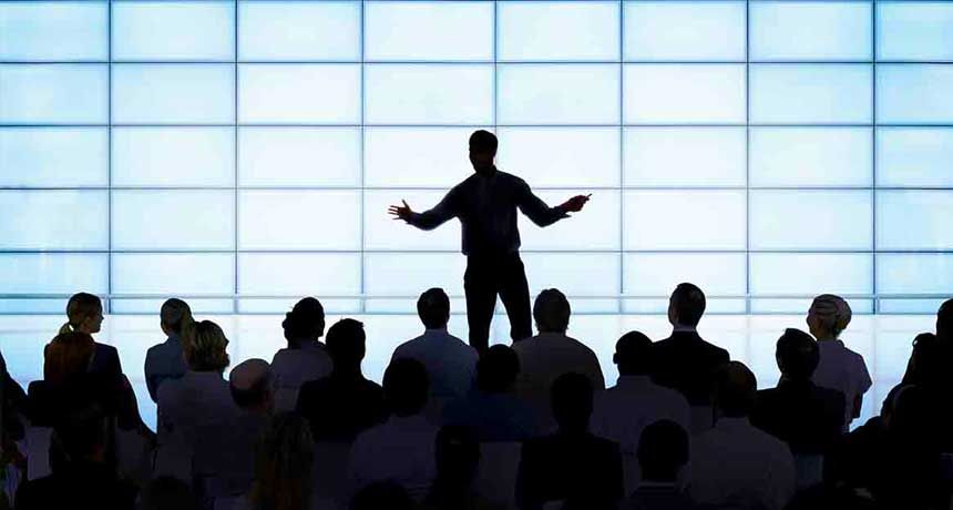 A man is giving a presentation to a group of people.