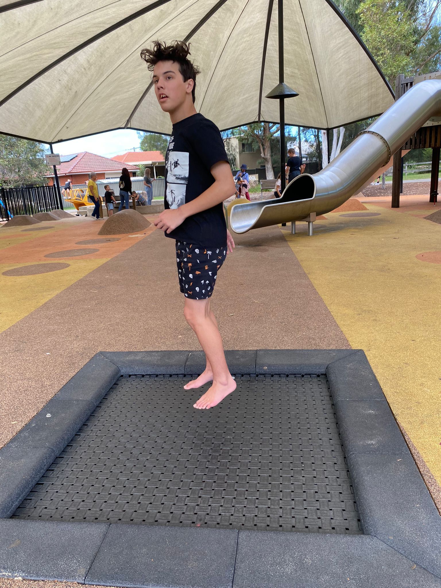 Allcare Vacation Care client jumping on inground trampoline. Registered NDIS Disability Provider, Sydney and Brisbane.