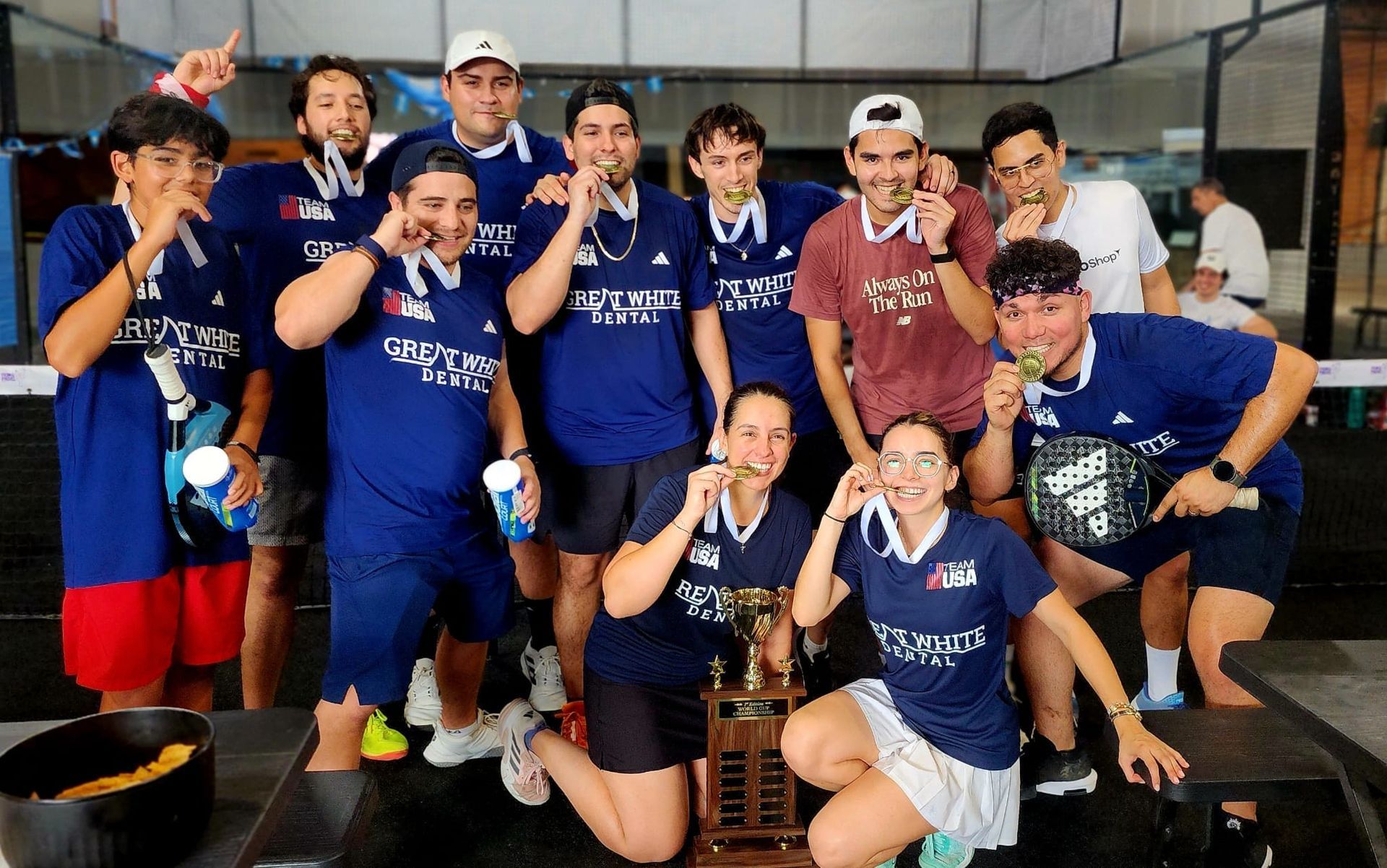 A woman is playing tennis on a purple court.