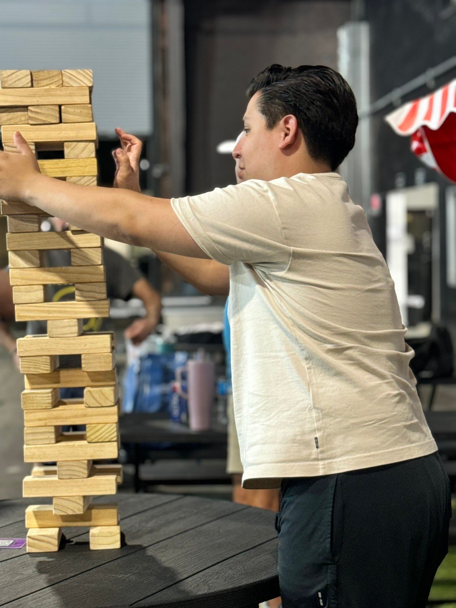 Two men are playing a game of paddle tennis on a court.