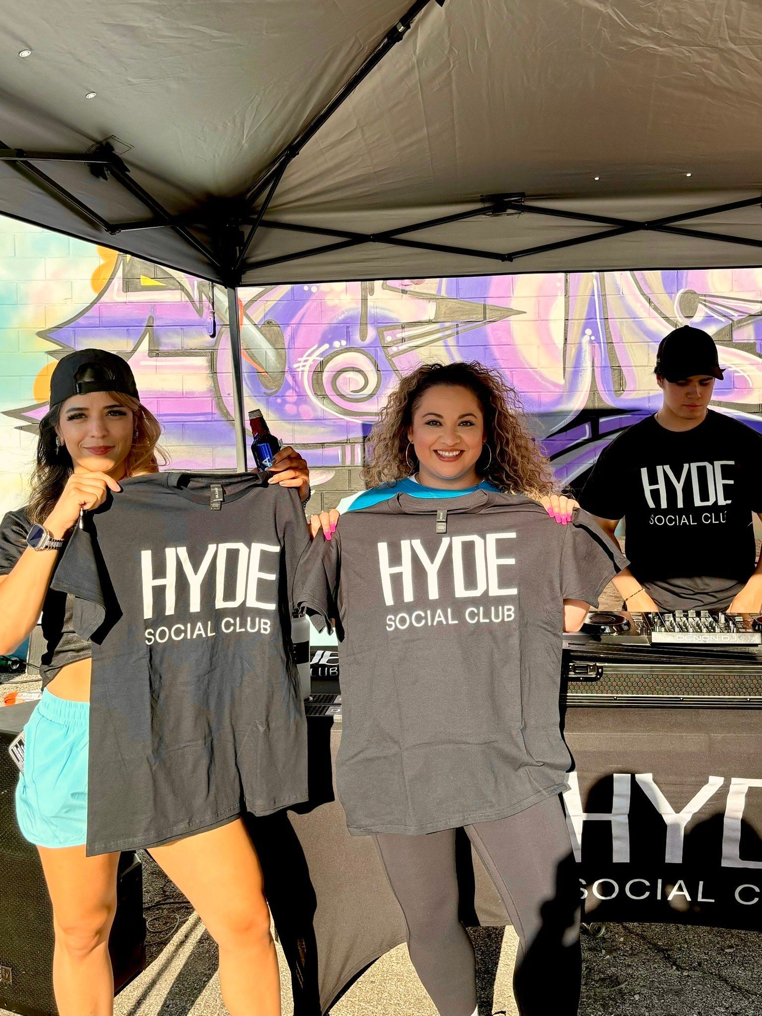 Two men wearing sombrero hats and a shirt that says hyde