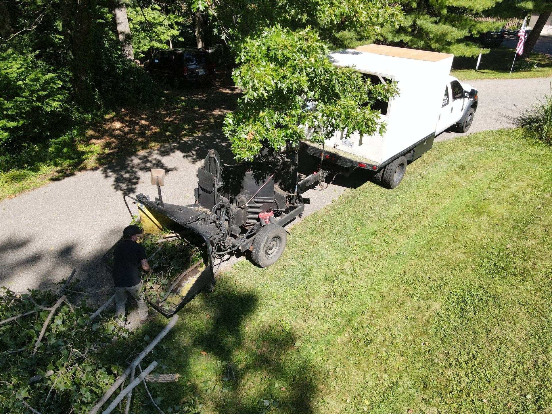 An aerial view of a tree stump grinder and a truck.