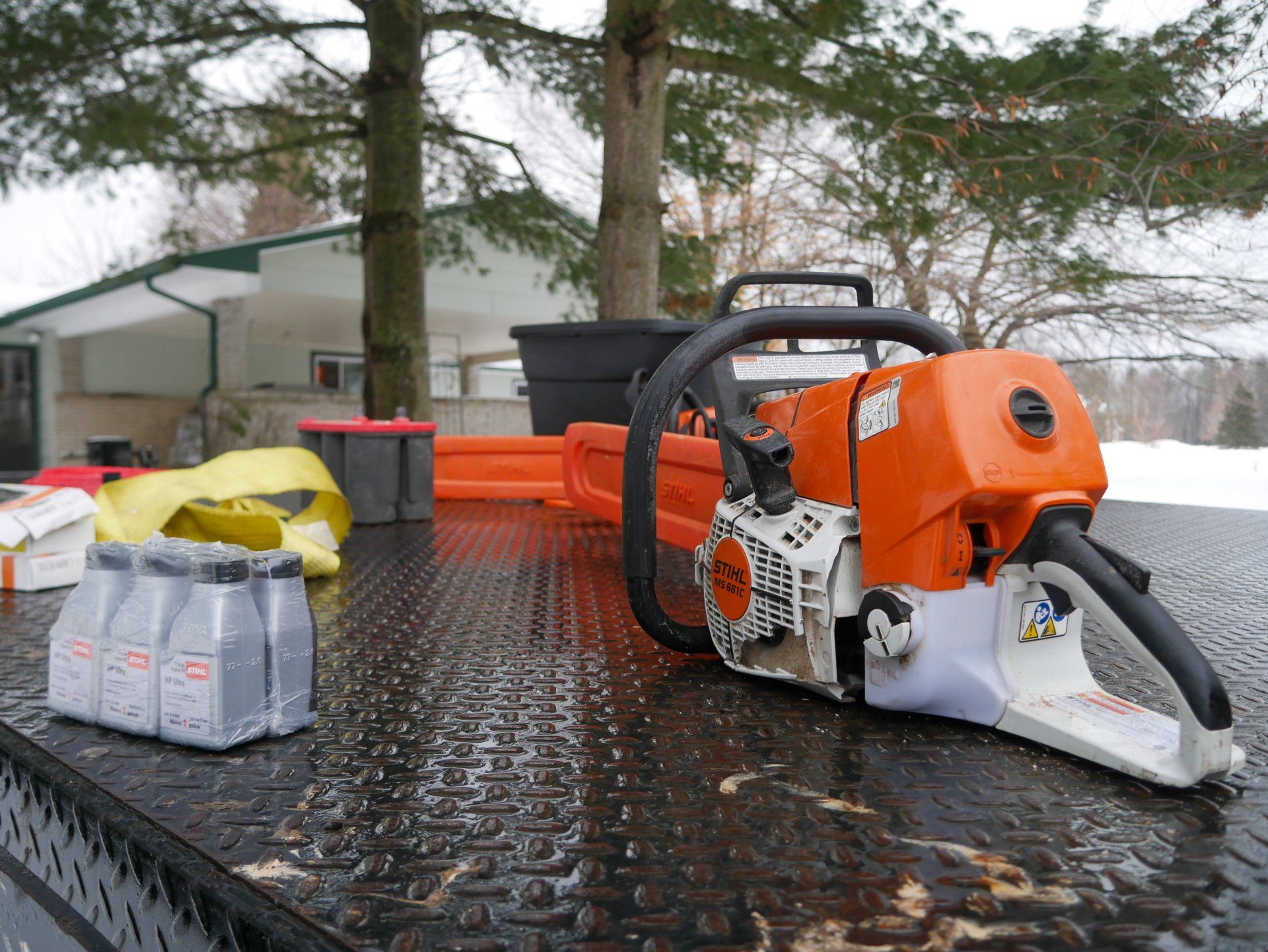 A stihl chainsaw is sitting on top of a table
