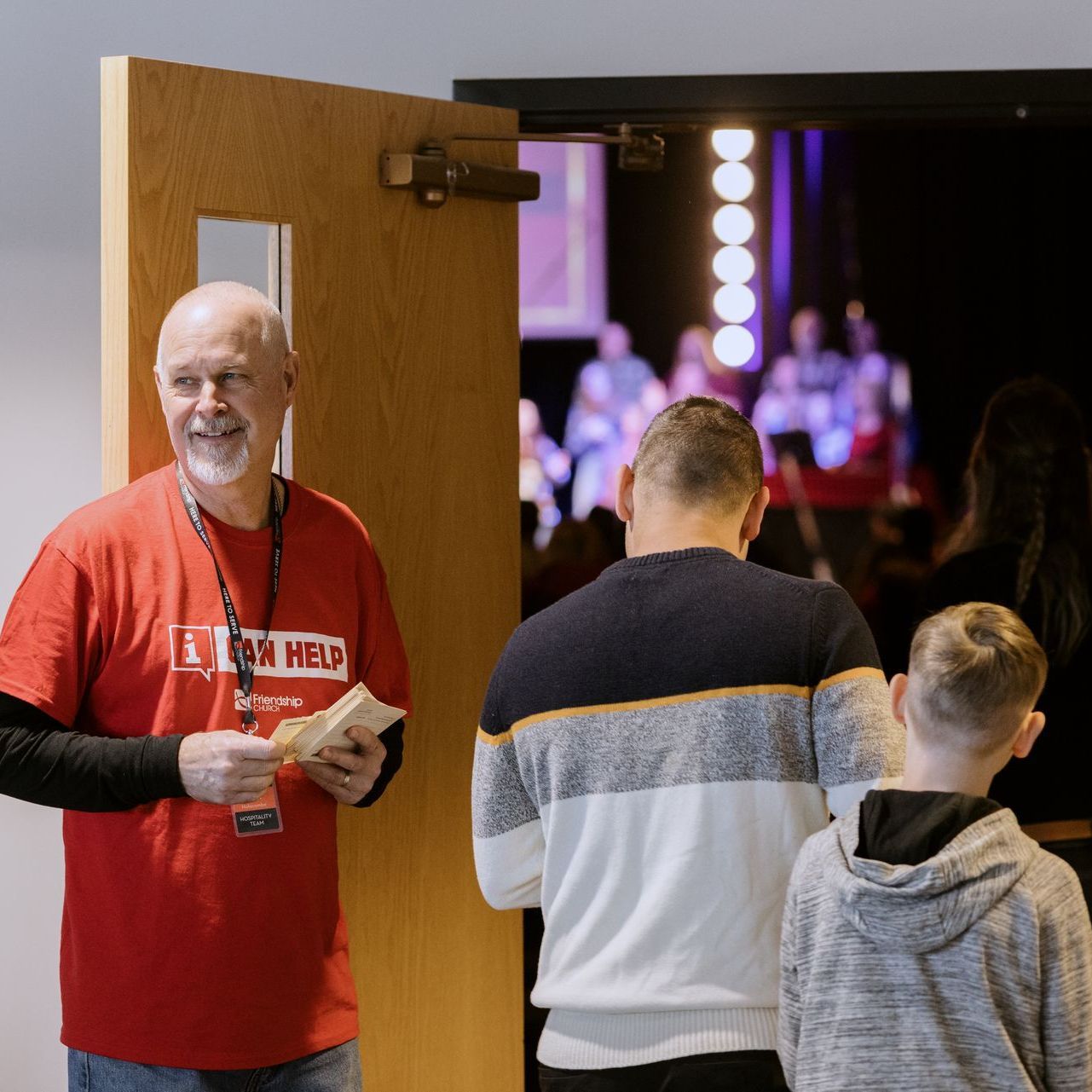 A man in a red shirt with the word head on it