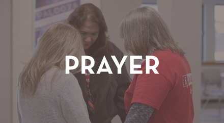 A group of women standing next to each other with the word prayer above them.