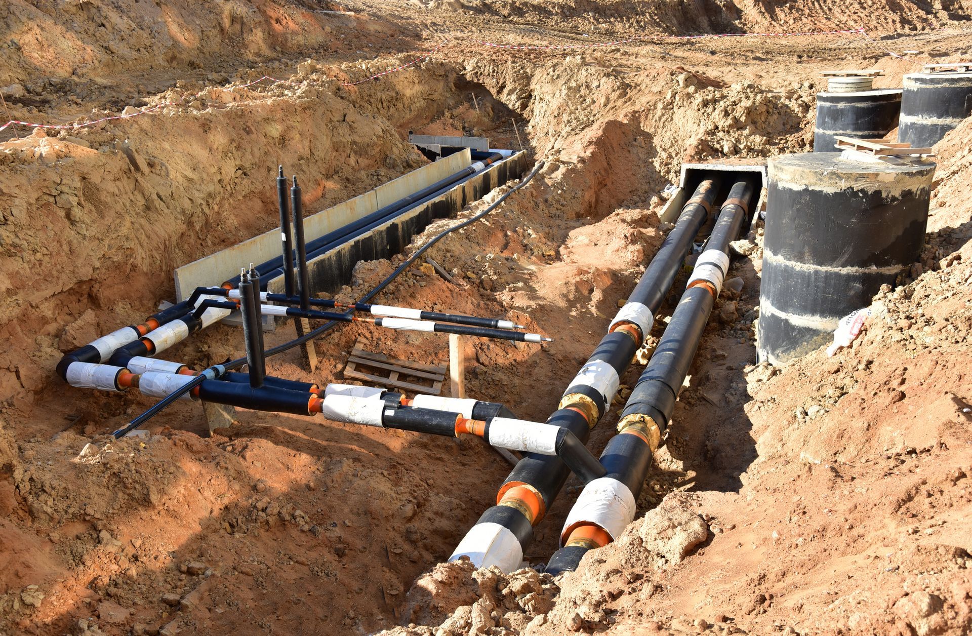 Laying heating pipes in trench at construction site by Robert L. Phillips in Lake Wales, 