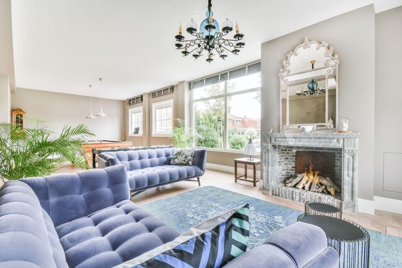 A living room filled with furniture and a fireplace.