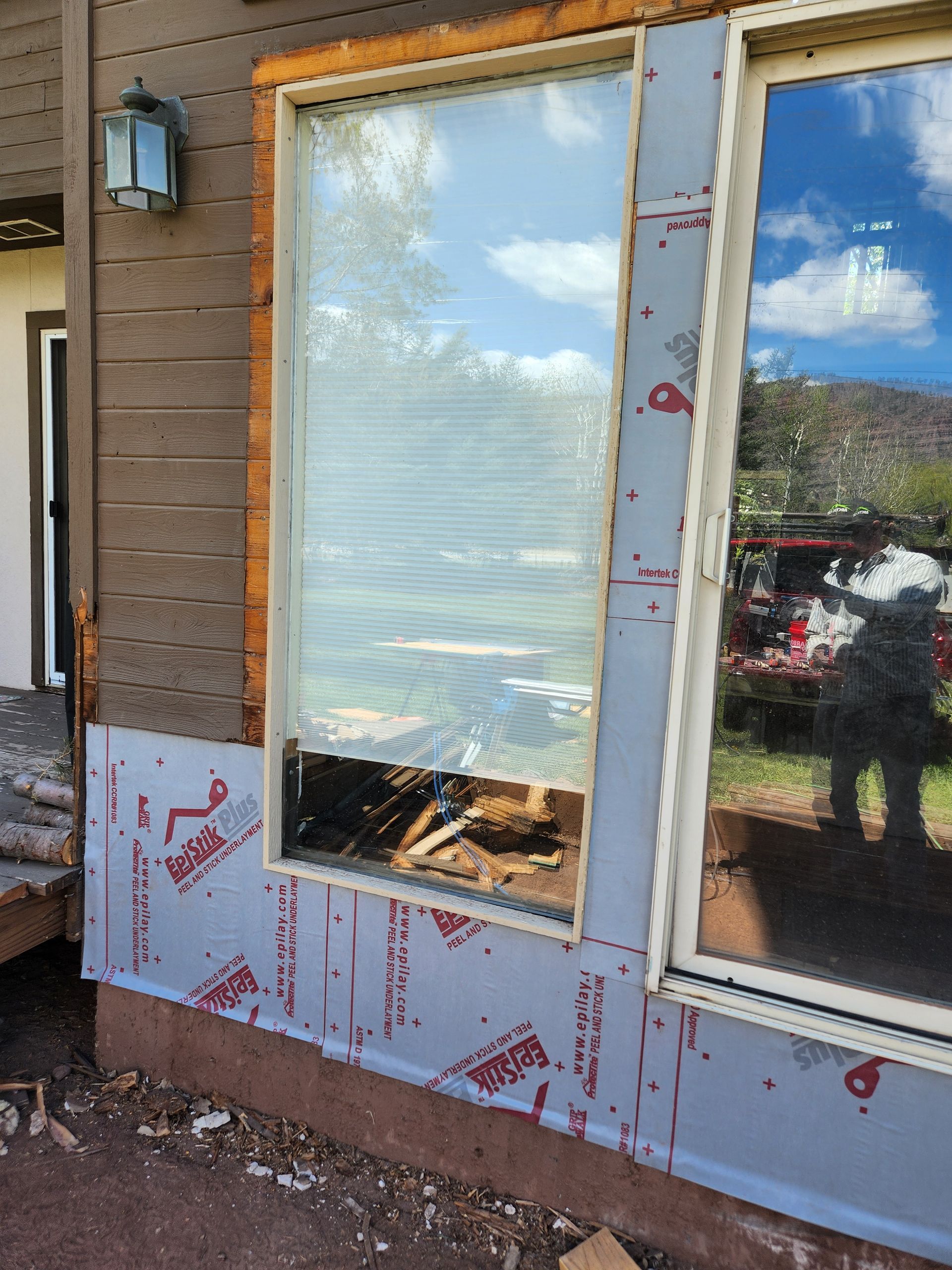 Split image: renovated modern dining area and under-construction space with exposed concrete wall, buckets, and broom.