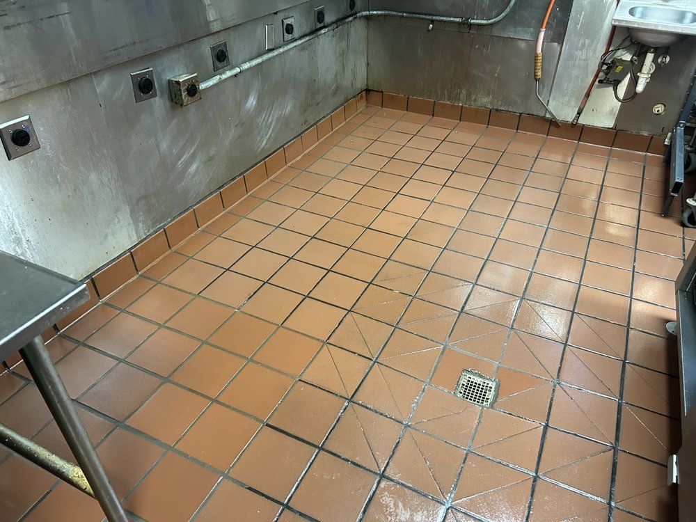 A kitchen with a tiled floor and a sink.