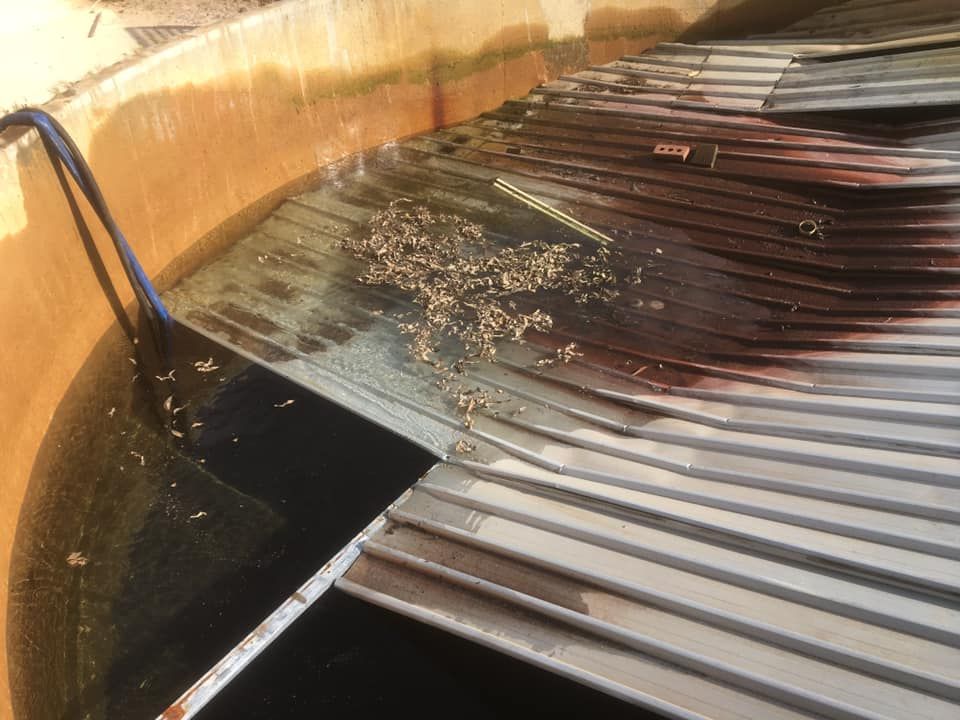 A Close Up Of A Metal Roof With A Hose Coming Out Of It – Perth, WA - Armadale Concrete Tank Co.