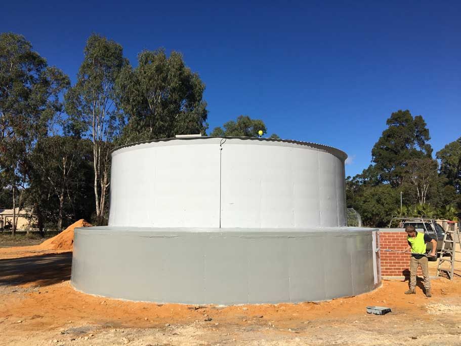 A Large White Water Tank Is Being Built In A Dirt Field – Perth, WA - Armadale Concrete Tank Co.