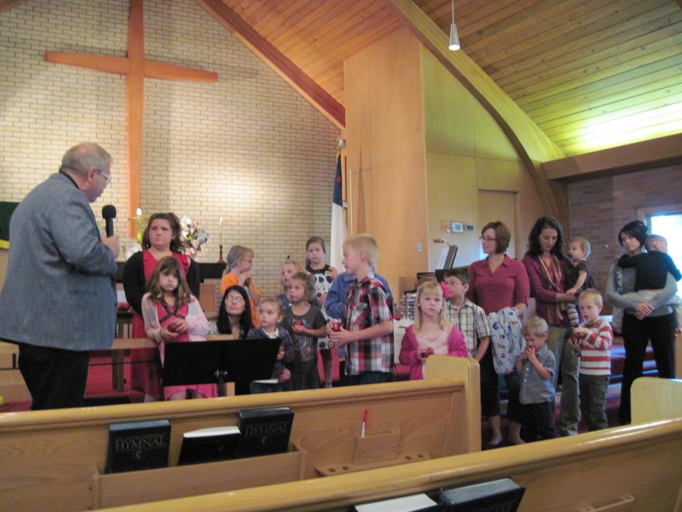 children listening to pastor