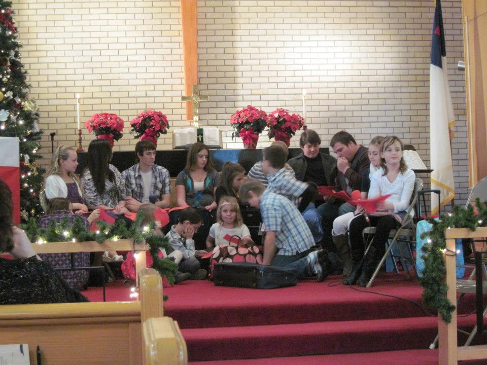 kids sitting in a church
