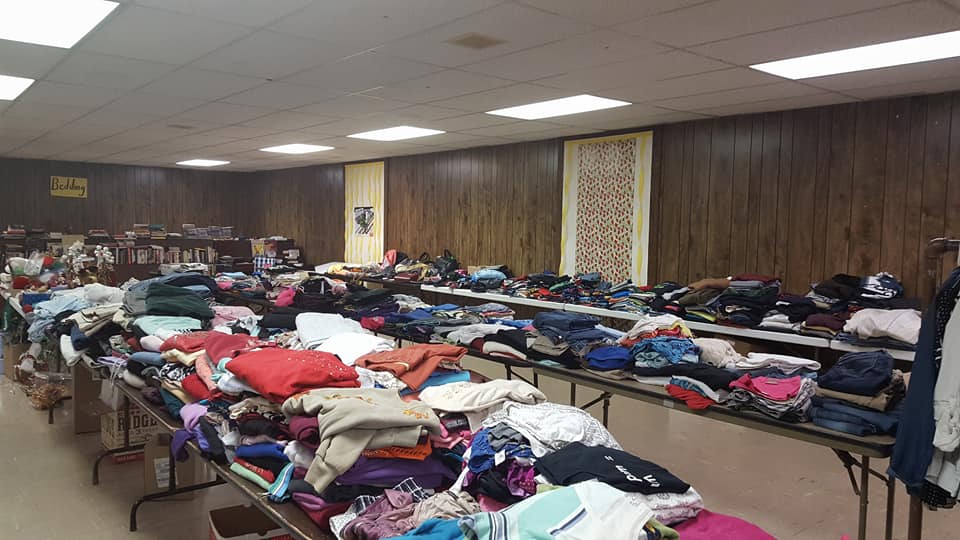 clothing laid out for rummage sale