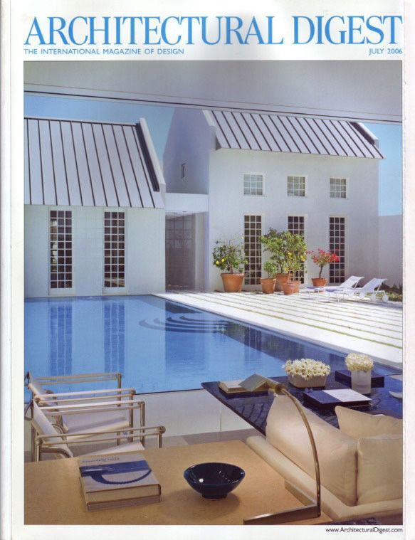 An architectural digest magazine with a swimming pool on the cover