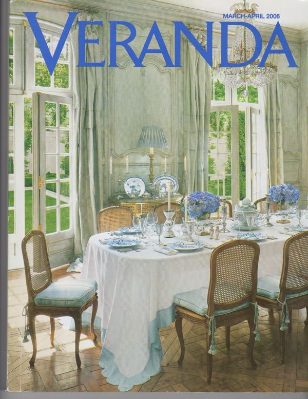 The cover of veranda magazine shows a dining room with a table and chairs
