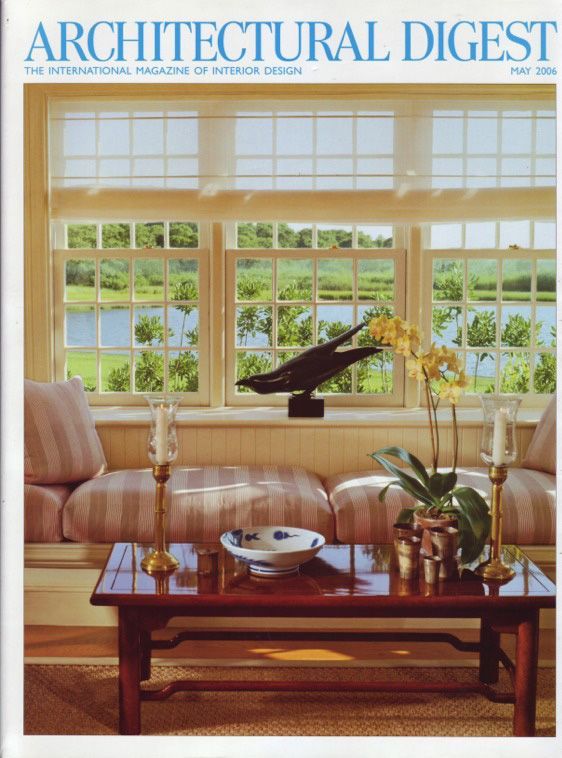 An architectural digest magazine with a living room on the cover