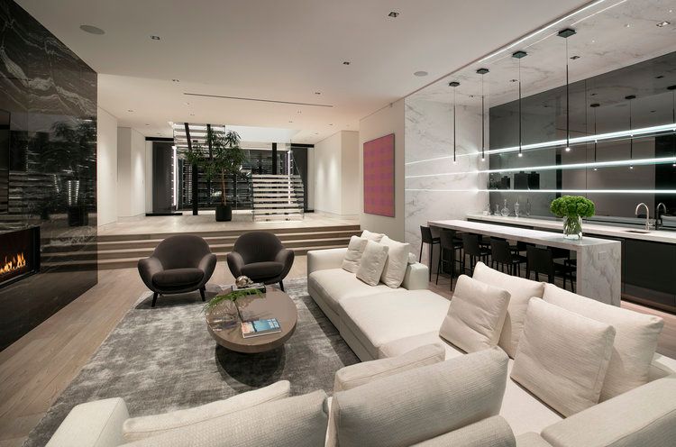 A living room filled with furniture and a fireplace.