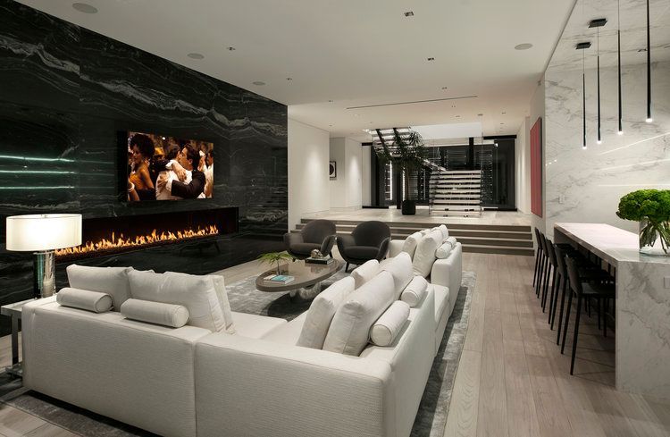 A living room filled with furniture and a fireplace.