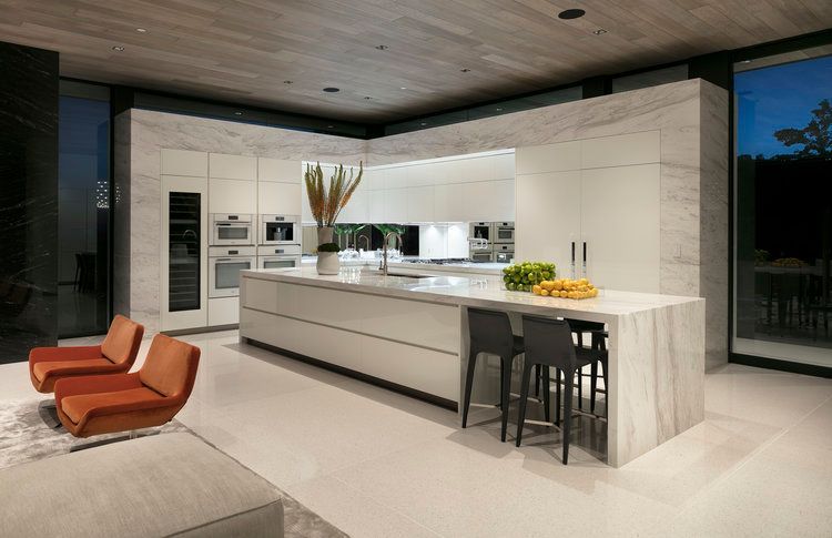 An artist 's impression of a modern kitchen with a large island.