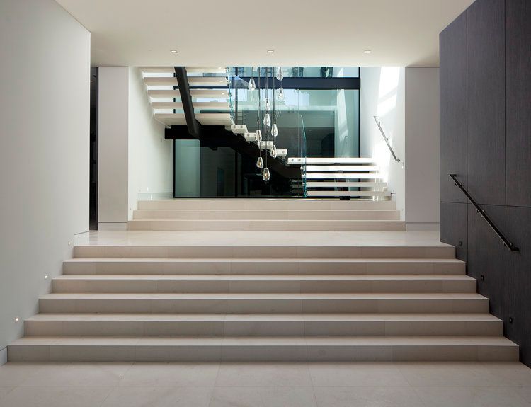 A set of stairs leading up to a staircase in a building