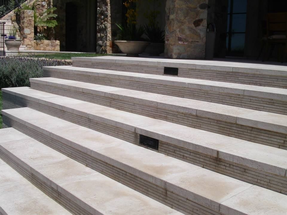 A set of stairs leading up to a stone building