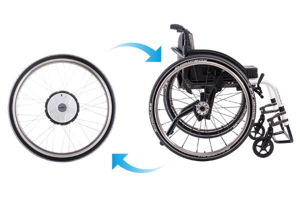 Electric wheelchair wheel being attached to a wheelchair frame.