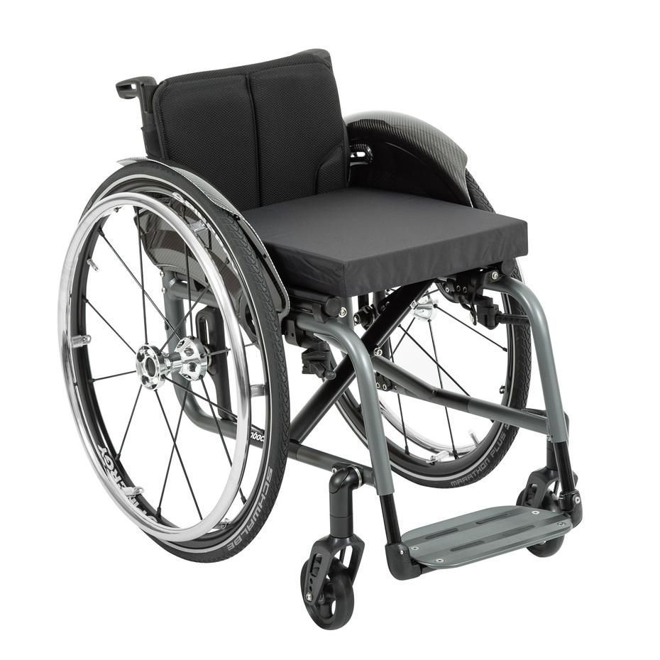 A gray wheelchair with a black seat and back, and large wheels.