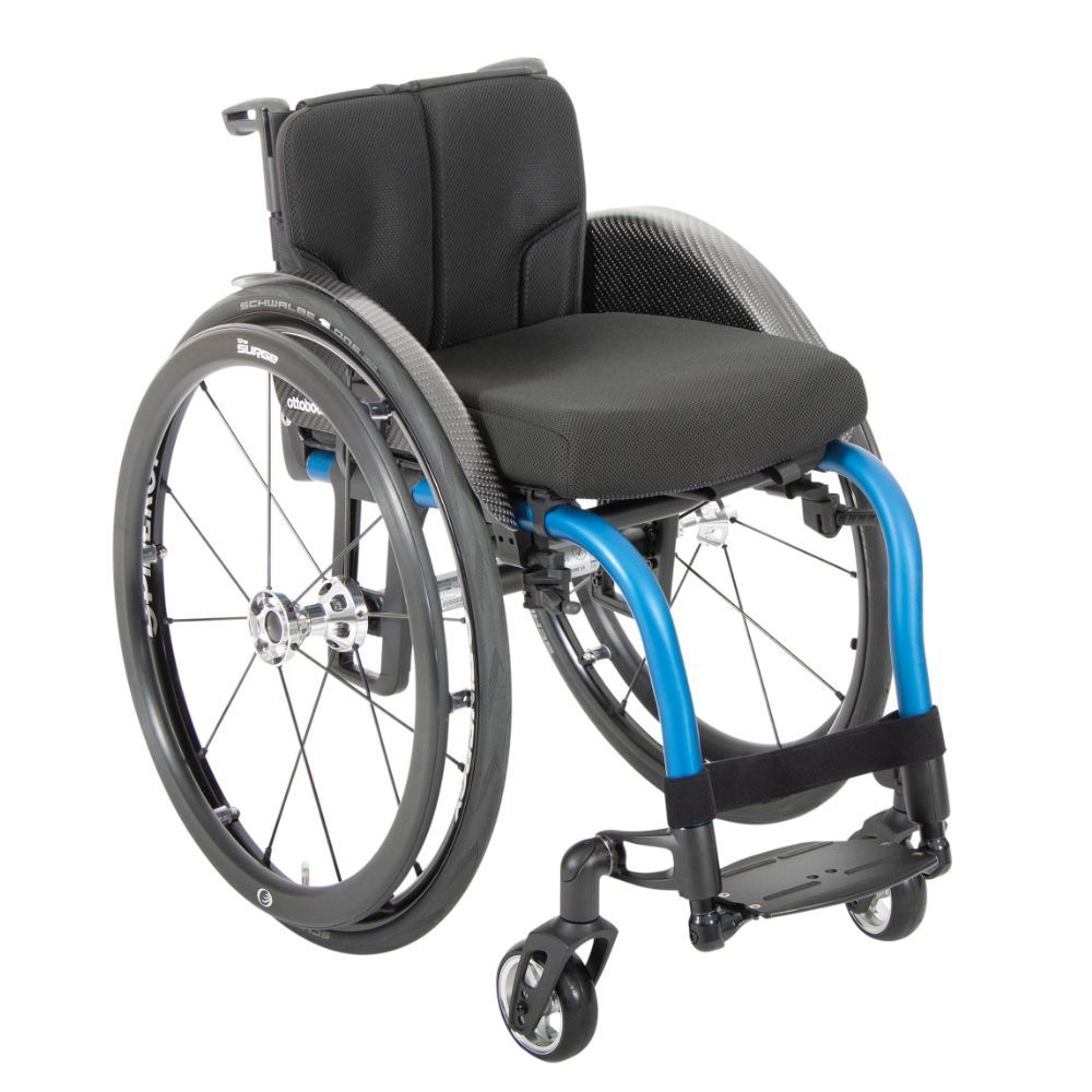 Blue and black manual wheelchair with large rear wheels, carbon fiber components, and a black cushion.